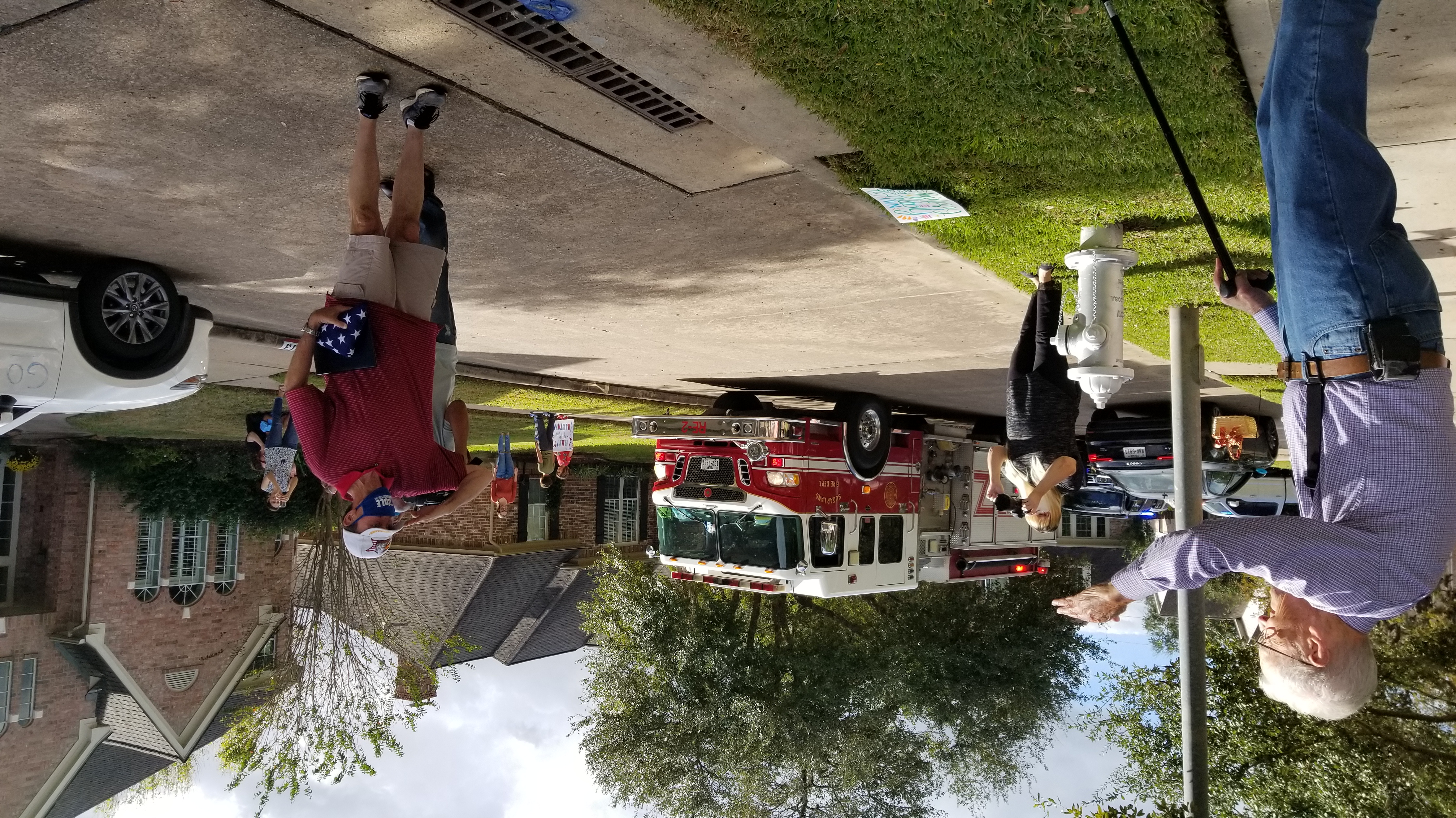 U.S. Rep. Pete Olson salutes before presenting flag